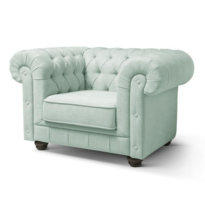 Sillón Chesterfield con capitoné real tapizado en tela
