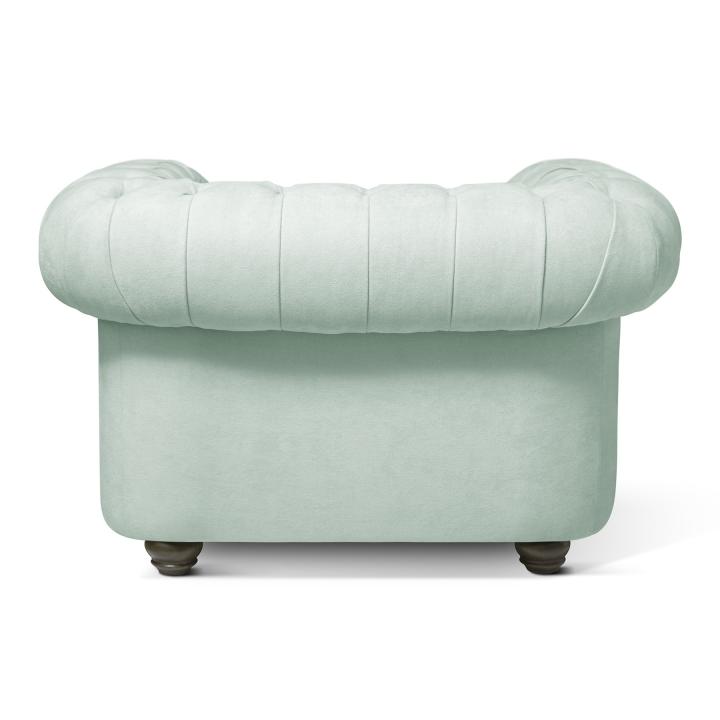 Sillón Chesterfield con capitoné real tapizado en tela