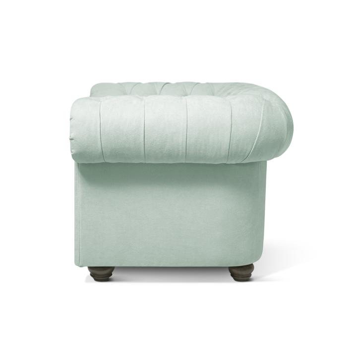 Sillón Chesterfield con capitoné real tapizado en tela