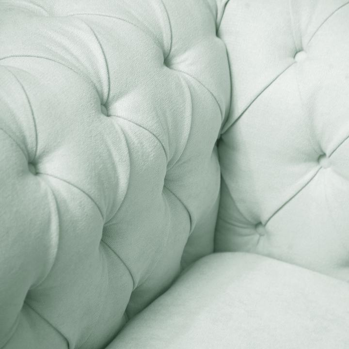 Sillón Chesterfield con capitoné real tapizado en tela