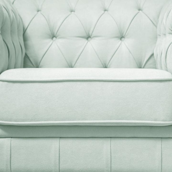Sillón Chesterfield con capitoné real tapizado en tela