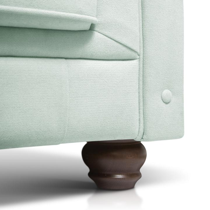 Sillón Chesterfield con capitoné real tapizado en tela