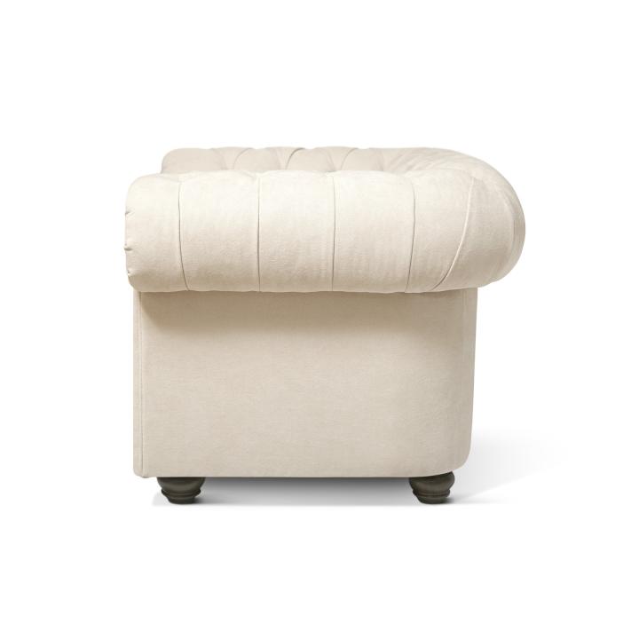 Sillón Chesterfield con capitoné real tapizado en tela