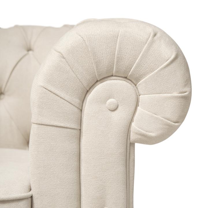 Sillón Chesterfield con capitoné real tapizado en tela