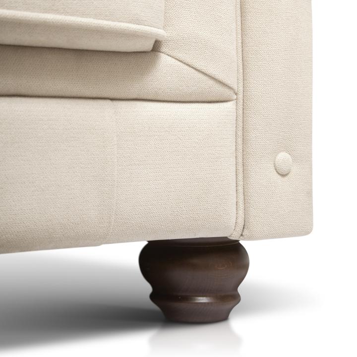 Sillón Chesterfield con capitoné real tapizado en tela