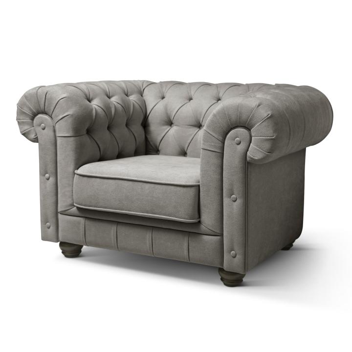 Sillón Chesterfield con capitoné real tapizado en tela