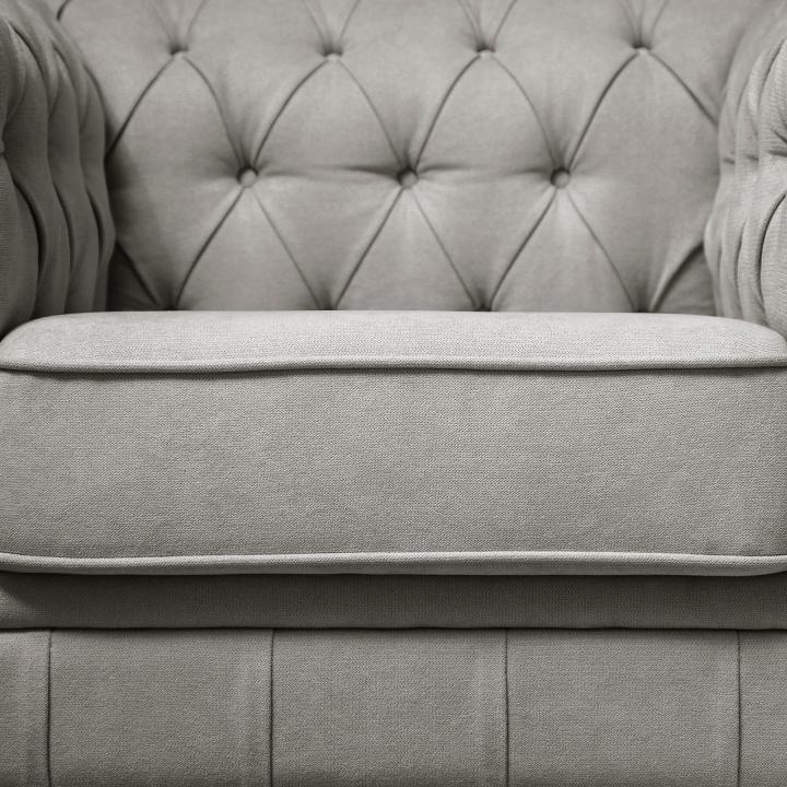 Sillón Chesterfield con capitoné real tapizado en tela