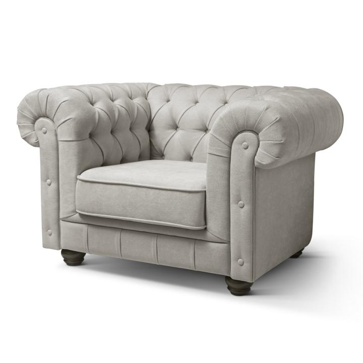 Sillón Chesterfield con capitoné real tapizado en tela