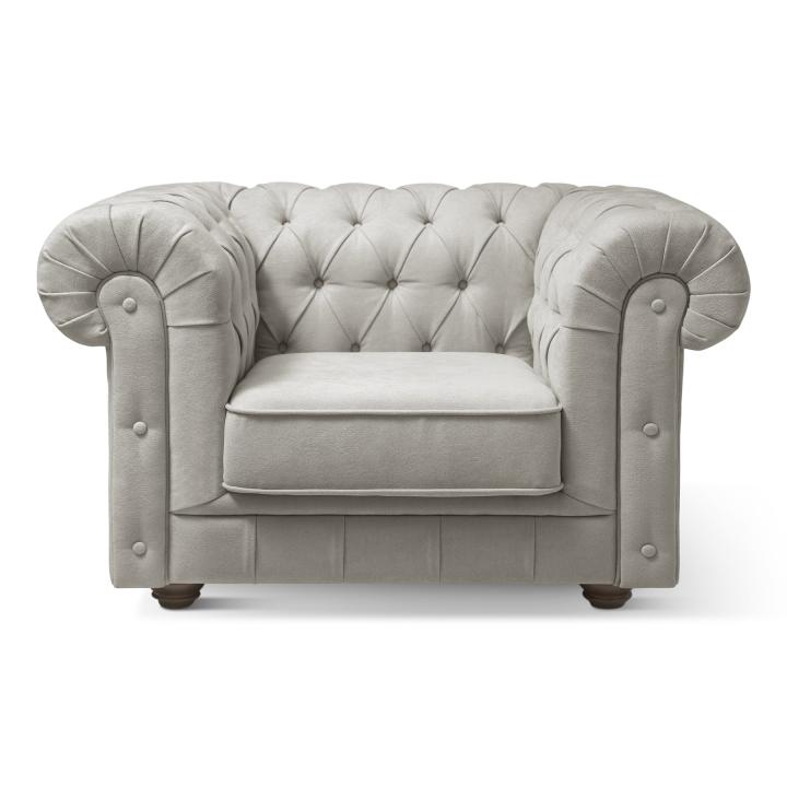 Sillón Chesterfield con capitoné real tapizado en tela
