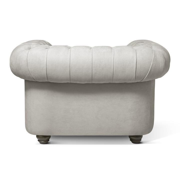 Sillón Chesterfield con capitoné real tapizado en tela