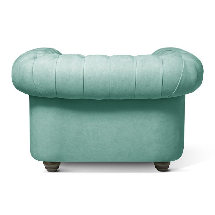 Sillón Chesterfield con capitoné real tapizado en tela