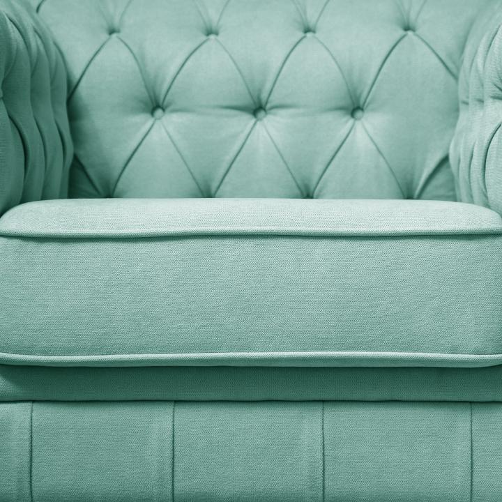 Sillón Chesterfield con capitoné real tapizado en tela