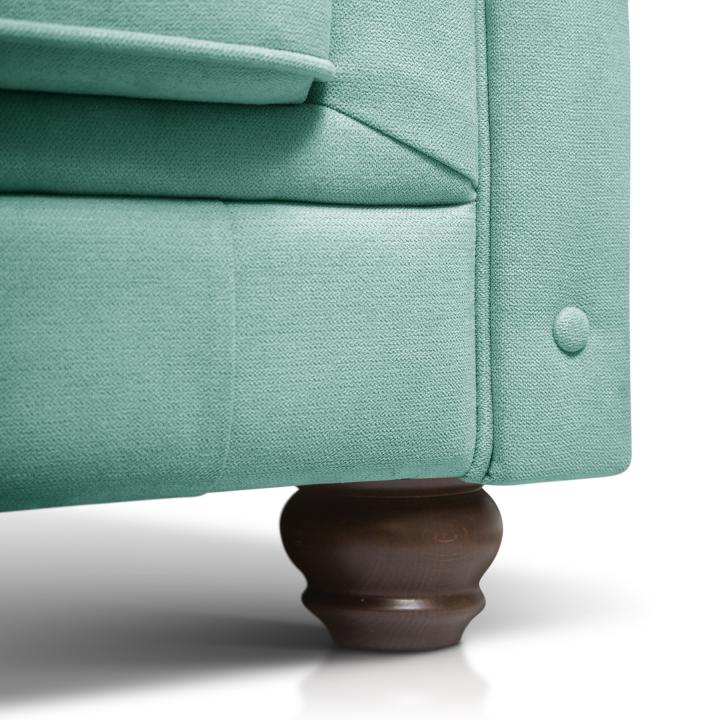 Sillón Chesterfield con capitoné real tapizado en tela